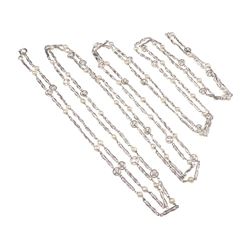 Platinum, diamond and pearl very long chain necklace
